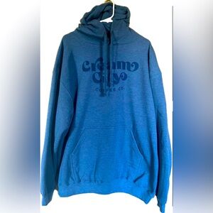Cream City Coffee hooded sweatshirt with front pocket. NWT. Unisex size XL